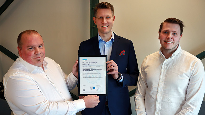 Westermo's Mattias Nässen (CIO), Niklas Mörth (CISO) and Gustav Isaksson (IT Cybser Security Expert) displaying the company's ISO 27001 certificate. 